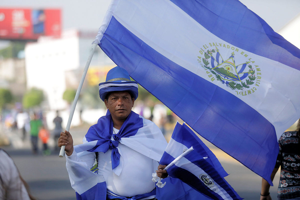 Salvadoran with the flag of El Salvador